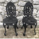 Pair of cast iron garden chairs.