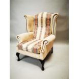 Upholstered wingback chair.