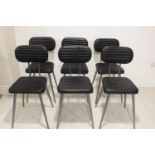 Set of six leather and metal dining chairs.