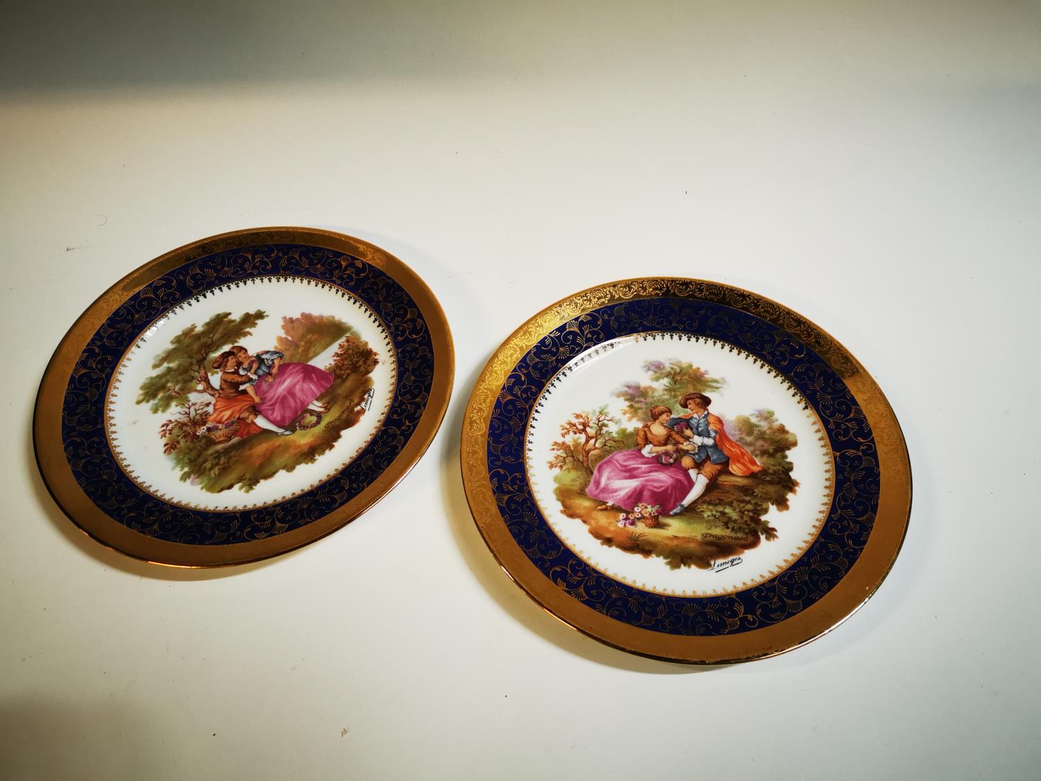 Pair of hand painted ceramic plates.