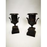 Pair of slate and marble urns.