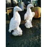Pair of cast stone eagles.