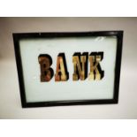 Bank sign mounted in pine frame.