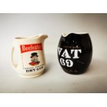 Two ceramic advertising jugs.