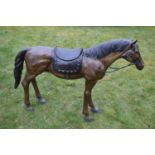 Bronze sculpture of a horse wearing a saddle W 153 H 112 D 35