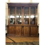 Superb quality early Victorian mahogany book case, the four glazed doors decorated with corbels W