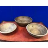 Three treen bowls, 19th Century, the largest W 50