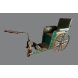 Exceptionally quirky late 19 Century pushing cart with pulling handle leather upholstery.