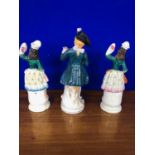 Set of 3 continental standing figures, the tallest 30 cm