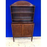 Edwardian inlaid mahogany open bookcase, the arched top above open shelving on cupboard base
