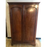 Fine Victorian two door wardrobe with arched top panels, fitted interior, standing on bracket feet W