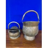 Two antique copper and 2 antique brass cauldrons.