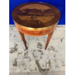 Continental circular games table, rosewood and kingswood. The top with profuse inlay, lifting to