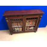 Irish Regency mahogany floor bookcase, the front with reeded pilasters, brass grilles standing on