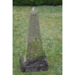 Carved stone obelisk engraved N-S-E-W on a square plinth W 35 H 85