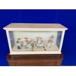 Quirky cased doll set, satirical medical and maternity puppets W 96 H 50 D 33