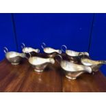 Set of 7 French silver plated sauce boats and another.
