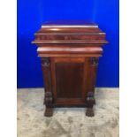 Regency mahogany pedestal, the lift top with baize interior above two doors framed by pilasters