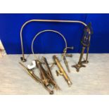 Collection of brass antique items including brass shower ring, hand rail and pipes.