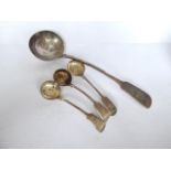 Fiddle pattern silver plated soup ladle and three similar crested sauce ladles.