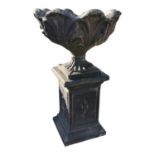 20th C. composition urn on pedestal.