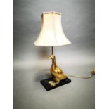 Brass table lamp in the form of a duck.