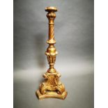 Gilt wood cricket candlestick.