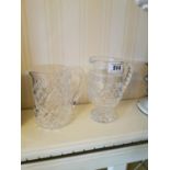 Two cut glass water jugs.