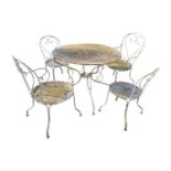 Wrought iron garden table and four chairs.