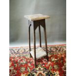 Edwardian oak jardiniere stand.