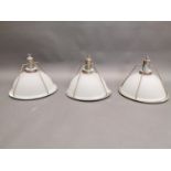 Set of three holophane hanging lights.