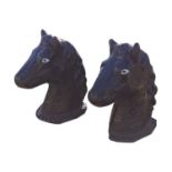 Pair of composition horse head pier cap.