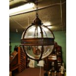 Bronzed metal globe lantern.