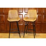 Pair of leather and metal upholstered Bakers stools