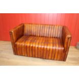 Two seater leather upholstered settee