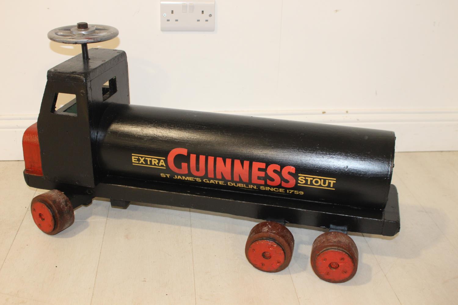 Wooden Guinness advertising toy tanker