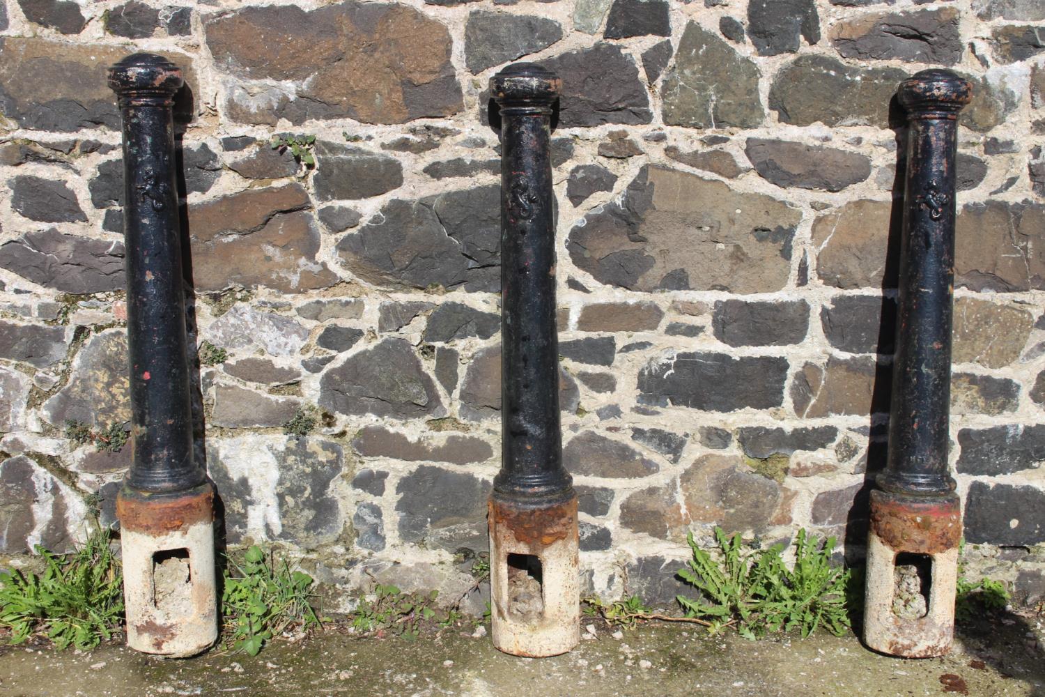 Set of three cast iron bollards