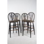 Set of four pine and upholstered bar stools.