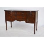 Mahogany serpentine sideboard.