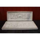 Pair of plaster moulded plaques