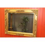 Carved giltwood wall mirror