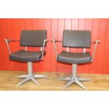 Pair of stylish swivel armchairs