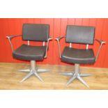 Pair of stylish swivel armchairs