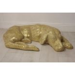 Golden glass mosaic model of Resting Dog