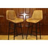 Pair of leather and metal upholstered Bakers stools