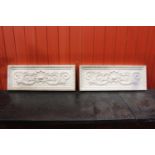 Pair of plaster moulded plaques