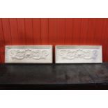 Pair of plaster moulded plaques