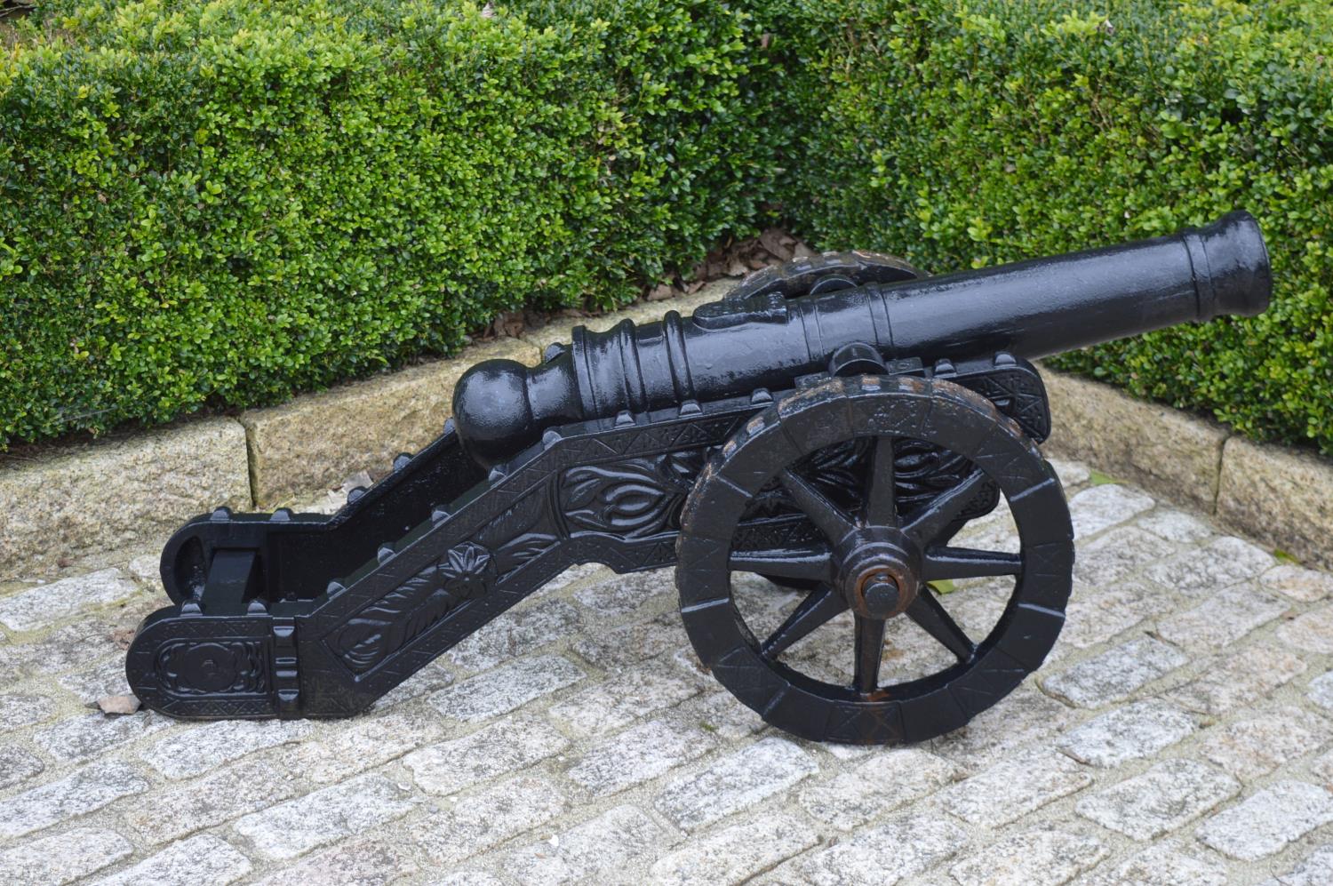 Pair of decorative cast iron models of cannons.