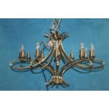 Brushed metal twelve branch chandelier.