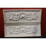 Pair of plaster moulded plaques